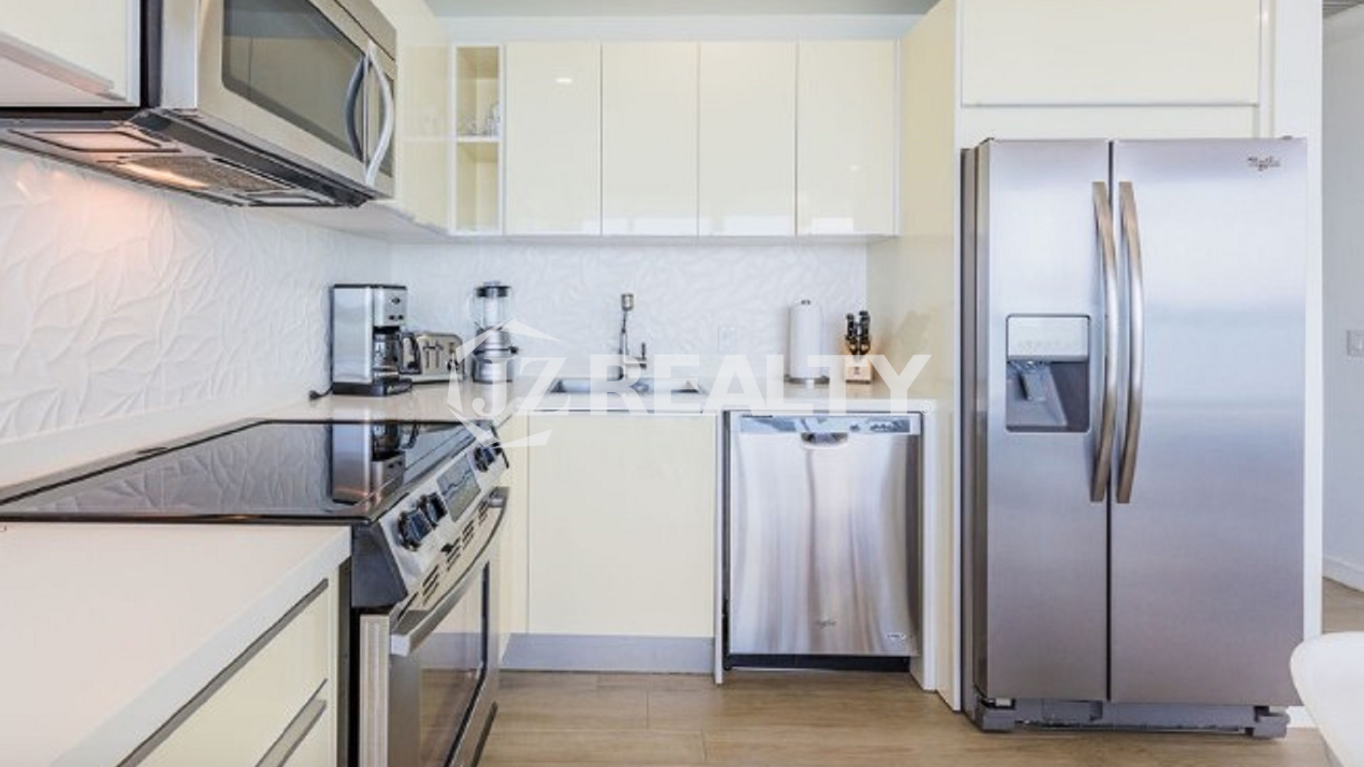 Condo 2-Bedroom Unit Blue Aruba modern kitchen with stainless steel appliances