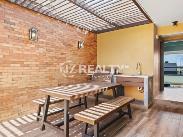 Porta al Sole Unit 11 outdoor covered dining and grilling area with a wooden picnic table, built-in stainless steel BBQ grill, and sink under a slatted pergola.
