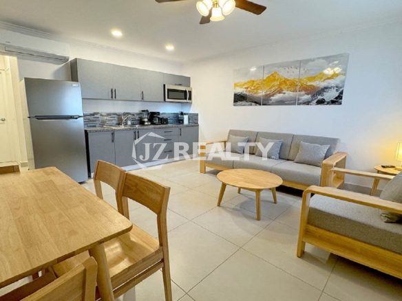 Open-plan living and dining area with a view of the kitchen.