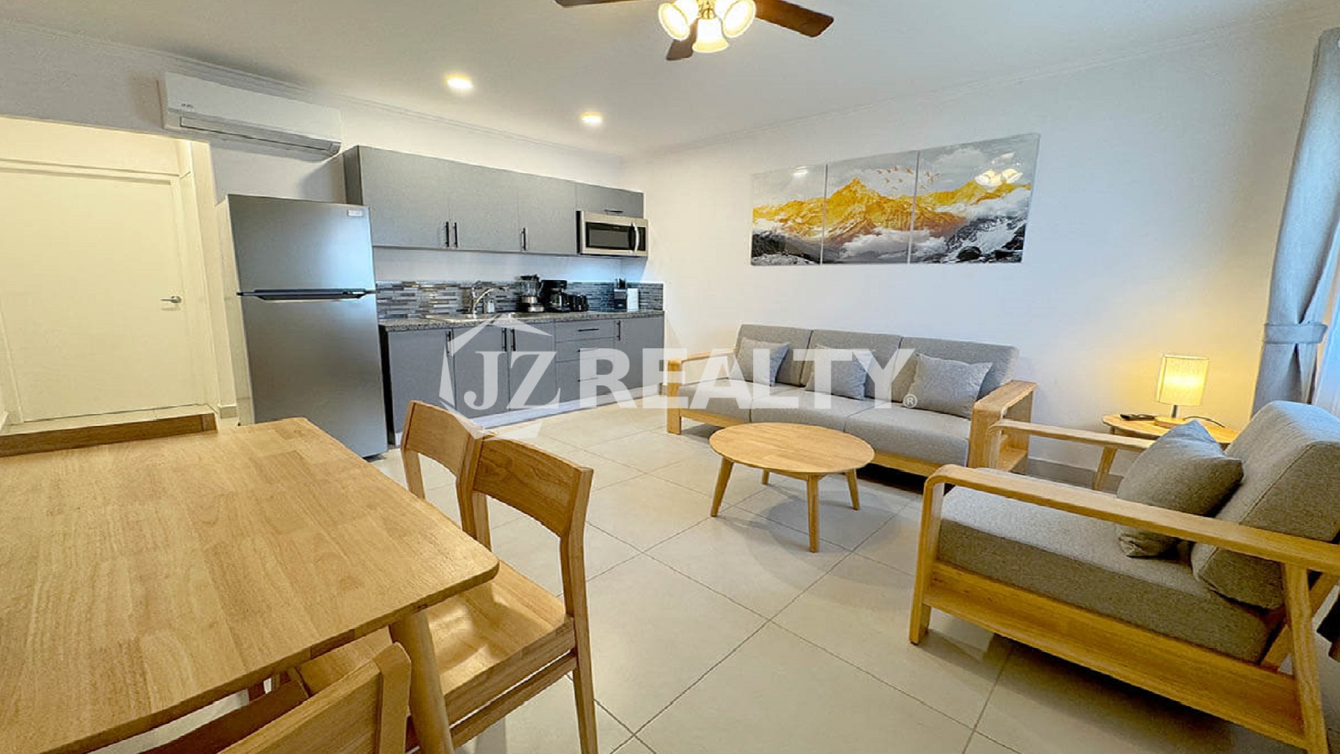 Open-plan living and dining area with a view of the kitchen.