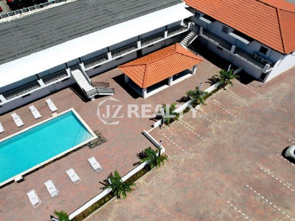 Aerial view of Bon Bini Suites pool area and surrounding buildings.