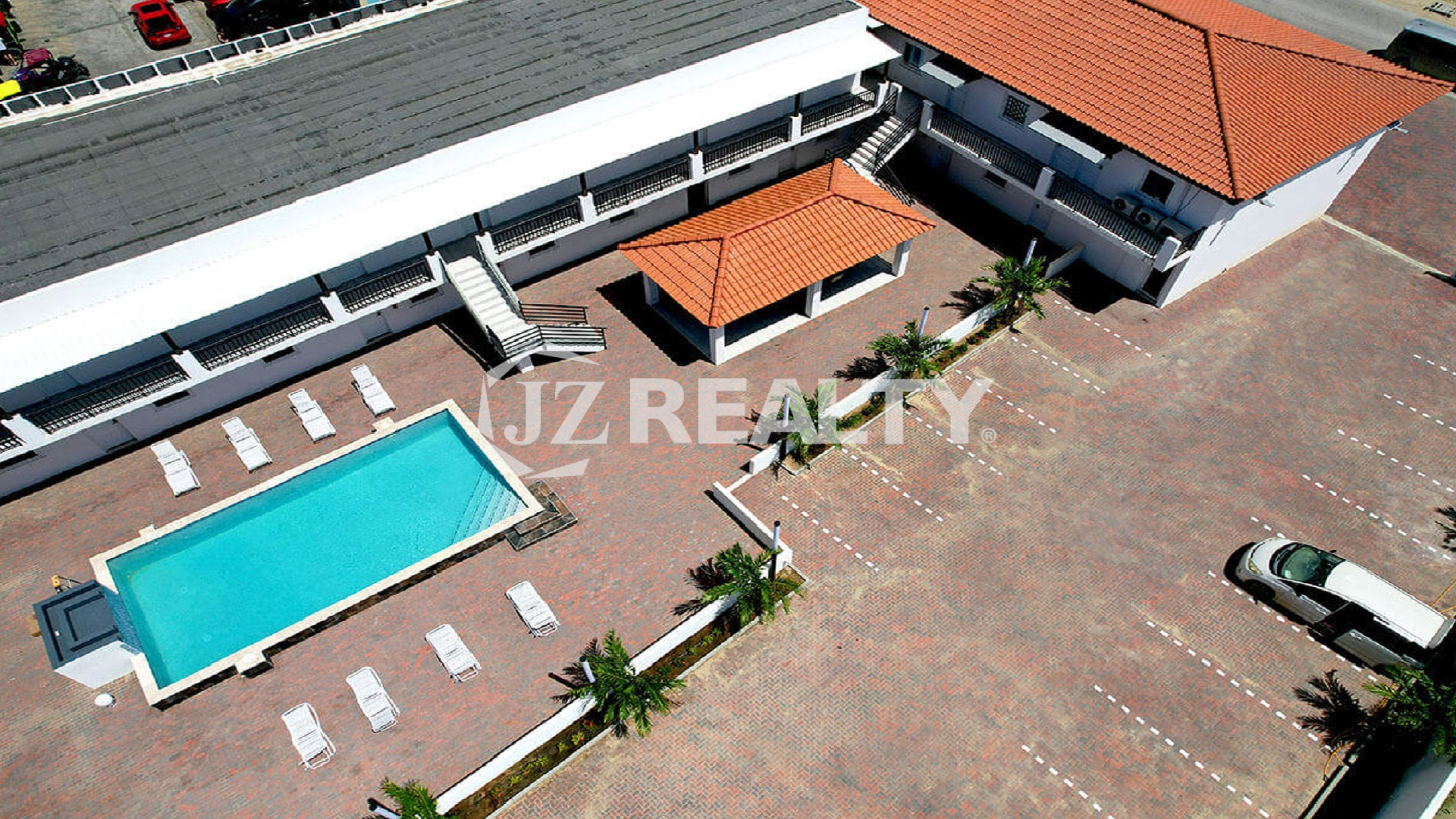 Aerial view of Bon Bini Suites pool area and surrounding buildings.