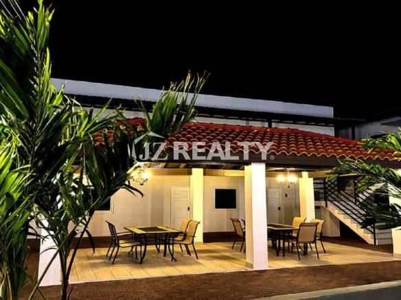 Night view of the outdoor covered dining patio.