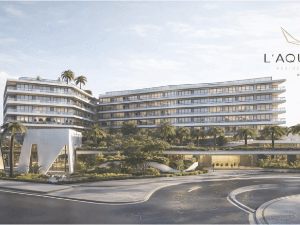 Exterior view of L’Aquila Residences condominium building in Aruba with modern architecture and landscaped entrance