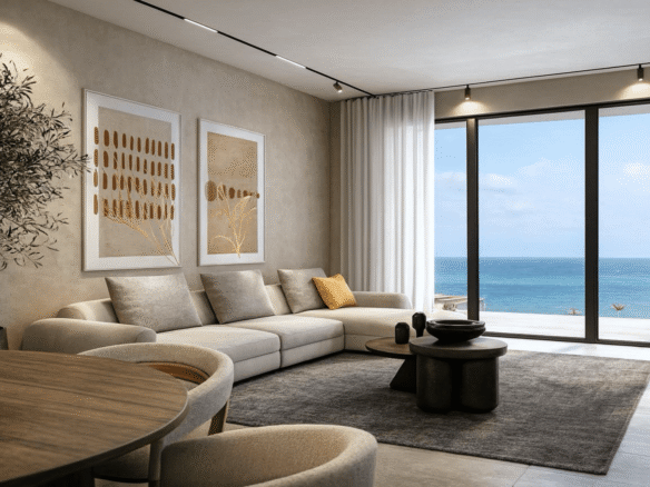 Living room with seating and ocean view windows in LAquila Residences Unit 102 type B condo in Aruba