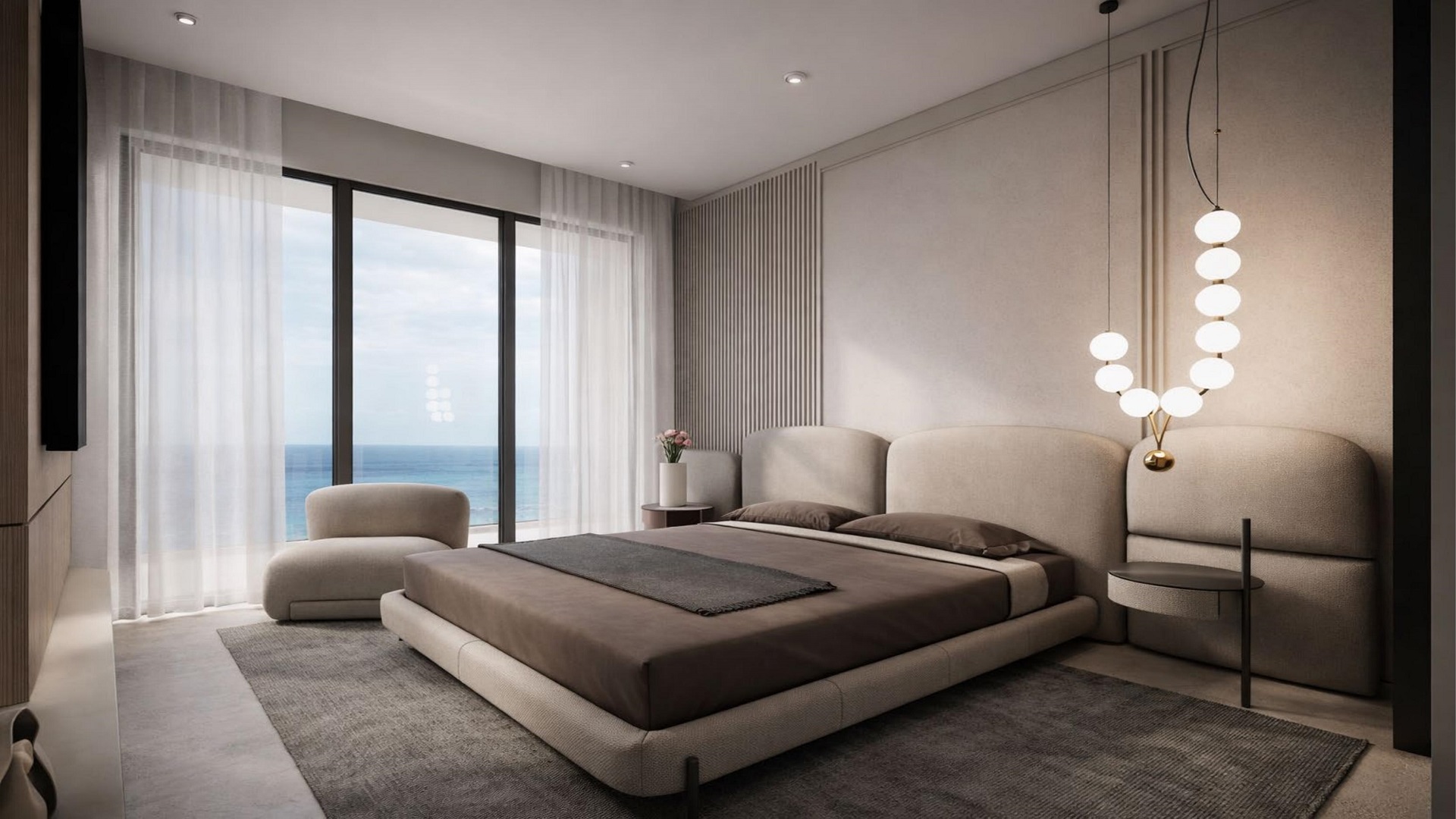 Bedroom with textured wall and window view in L’Aquila Residences Unit 301 Type A Aruba
