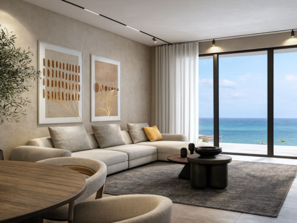 Living room with large windows and ocean view in L’Aquila Residences Unit 307 Type G in Aruba