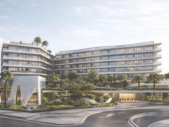 Exterior view of L’Aquila Residences building near Eagle Beach Aruba showcasing modern architecture and landscaped entrance