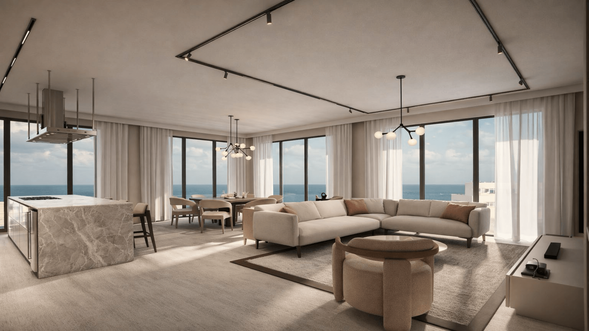 Open living room with kitchen island and ocean view in LAquila Residences Type E condo in Aruba