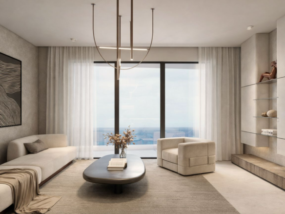 Living room with large windows and ocean view in L’Aquila Residences Unit F condo in Aruba