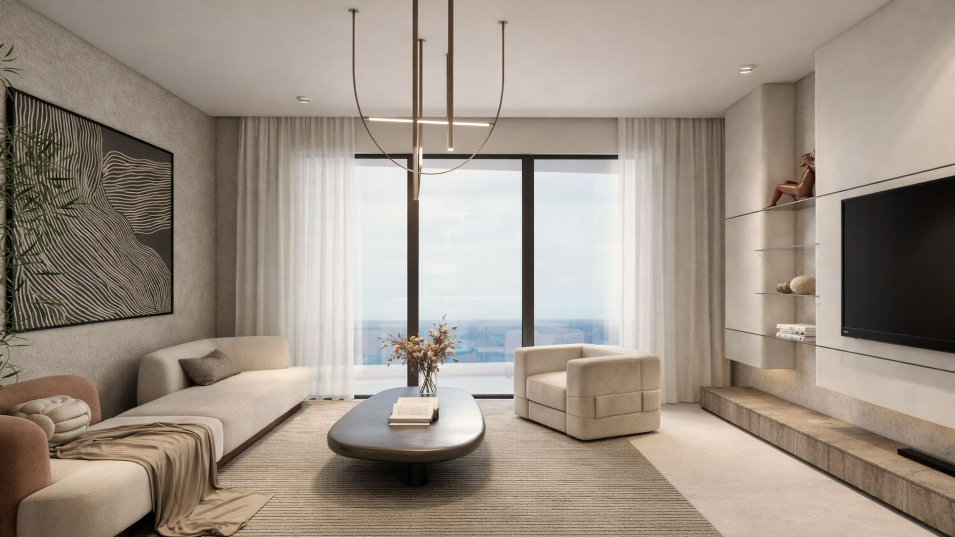 Living room with large windows and ocean view in L’Aquila Residences Unit F condo in Aruba