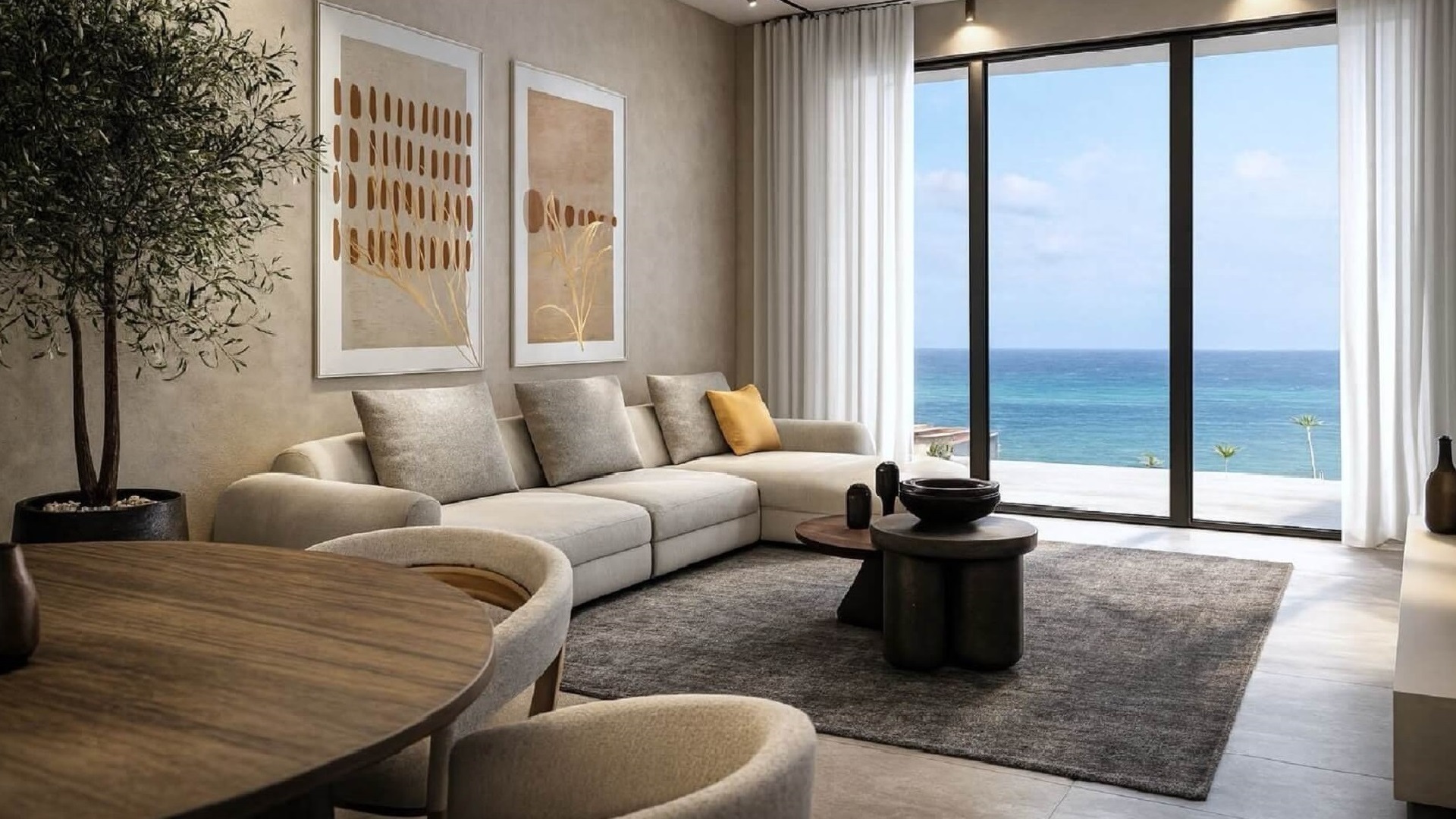 Living room with ocean view in Type B Unit 403 at L’Aquila Residences Oranjestad Aruba