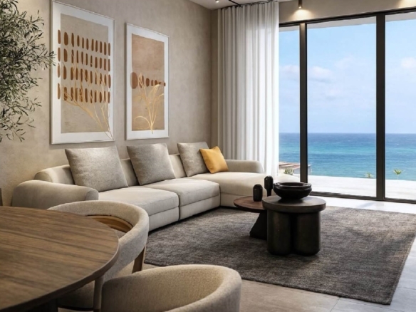 Living room with seating area and ocean view at L’Aquila Residences Type B Unit 503 near Eagle Beach Aruba