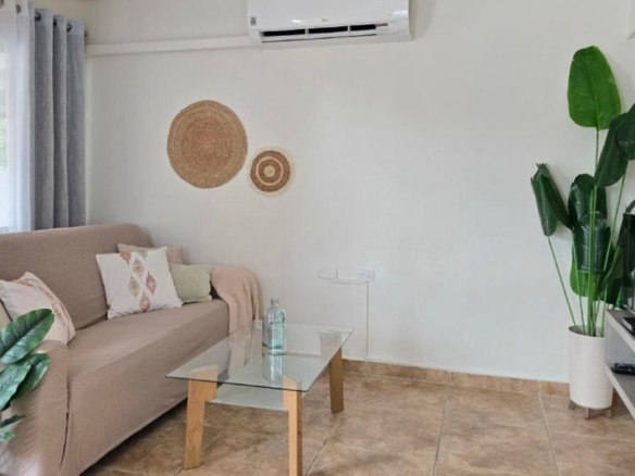 Condo 1 Rooi Santo Residence living room with sofa and tv