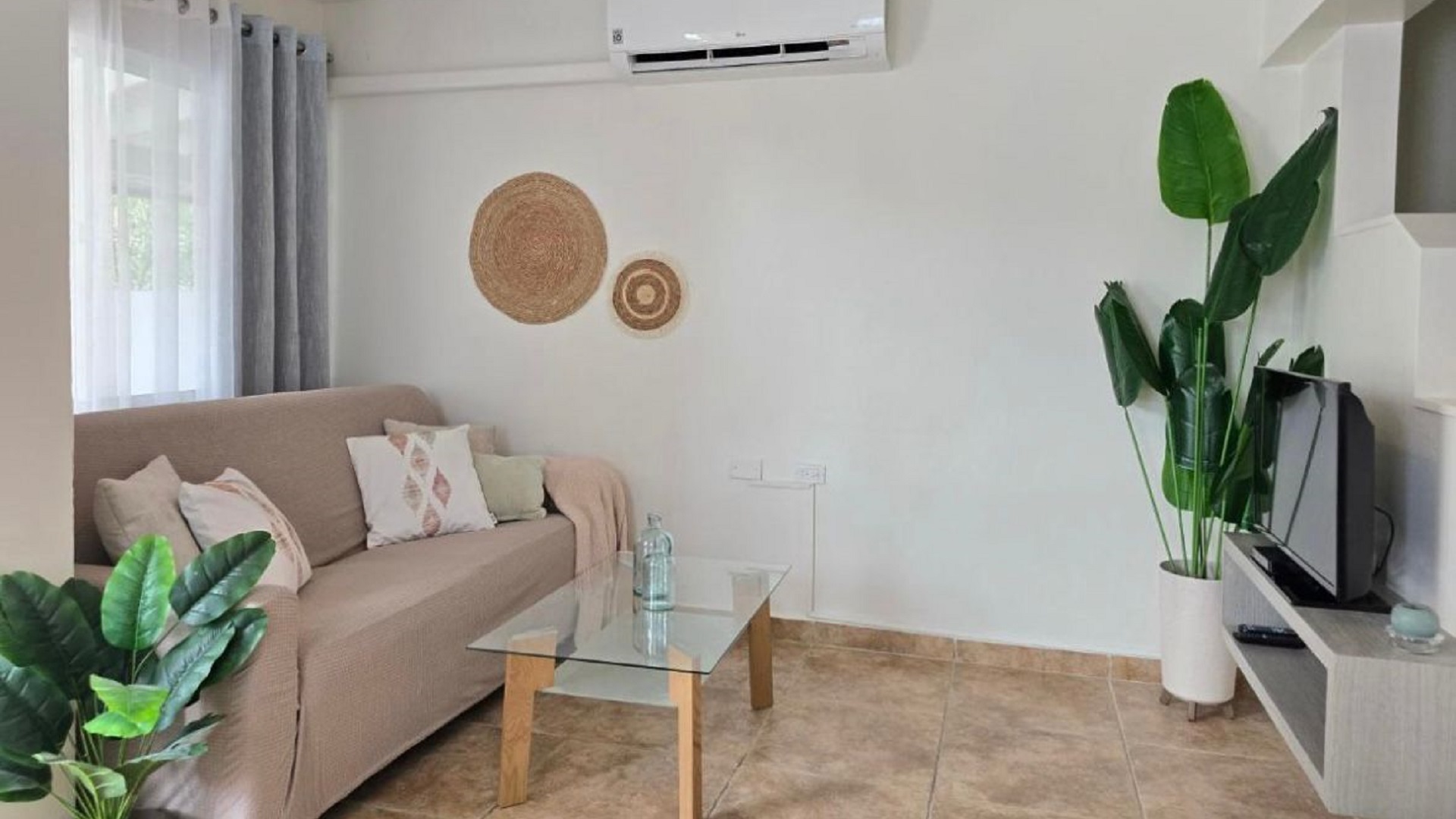 Condo 1 Rooi Santo Residence living room with sofa and tv