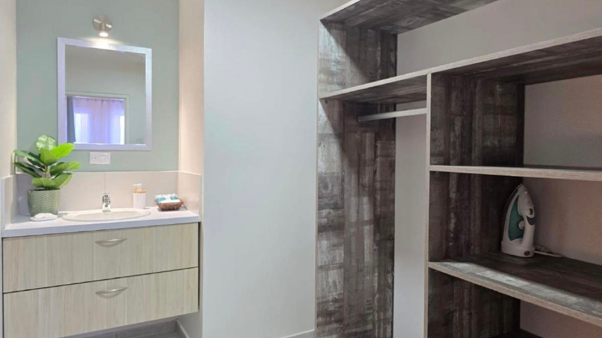 Condo 1 Rooi Santo Residence bathroom vanity and storage area