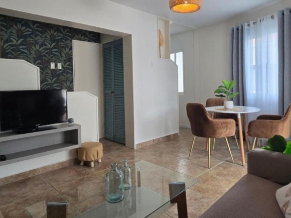 Condo 1 Rooi Santo Residence living room with tv area