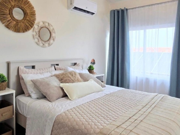 Condo 1 Rooi Santo Residence master bedroom with window view