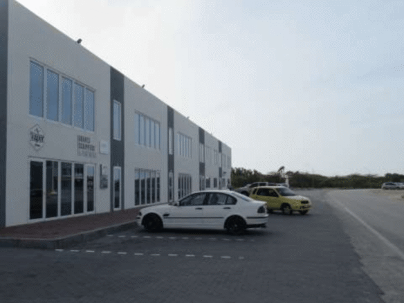 Magdalena Development Commercial Building exterior parking road side view