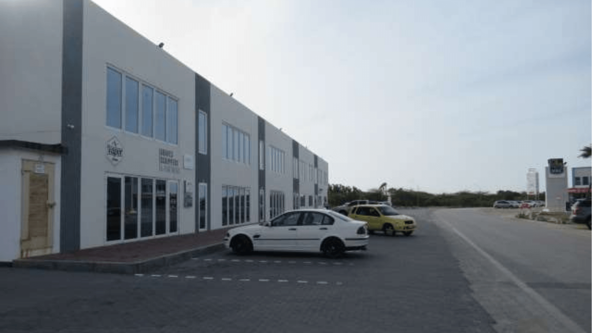 Magdalena Development Commercial Building exterior parking road side view