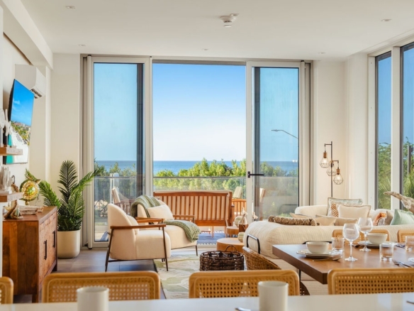Spacious living room with ocean view at Reef 2B condo Aruba