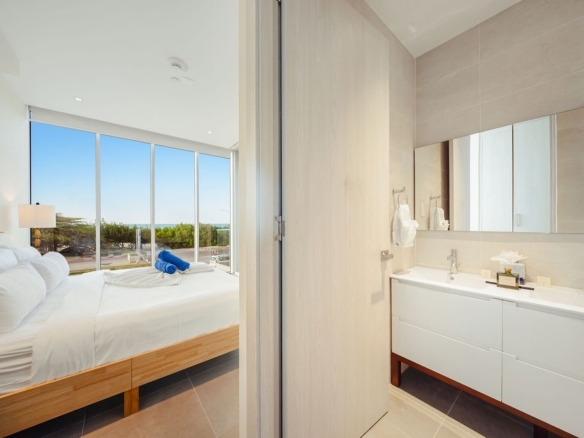 Open concept living and dining area Reef 2B Aruba condo