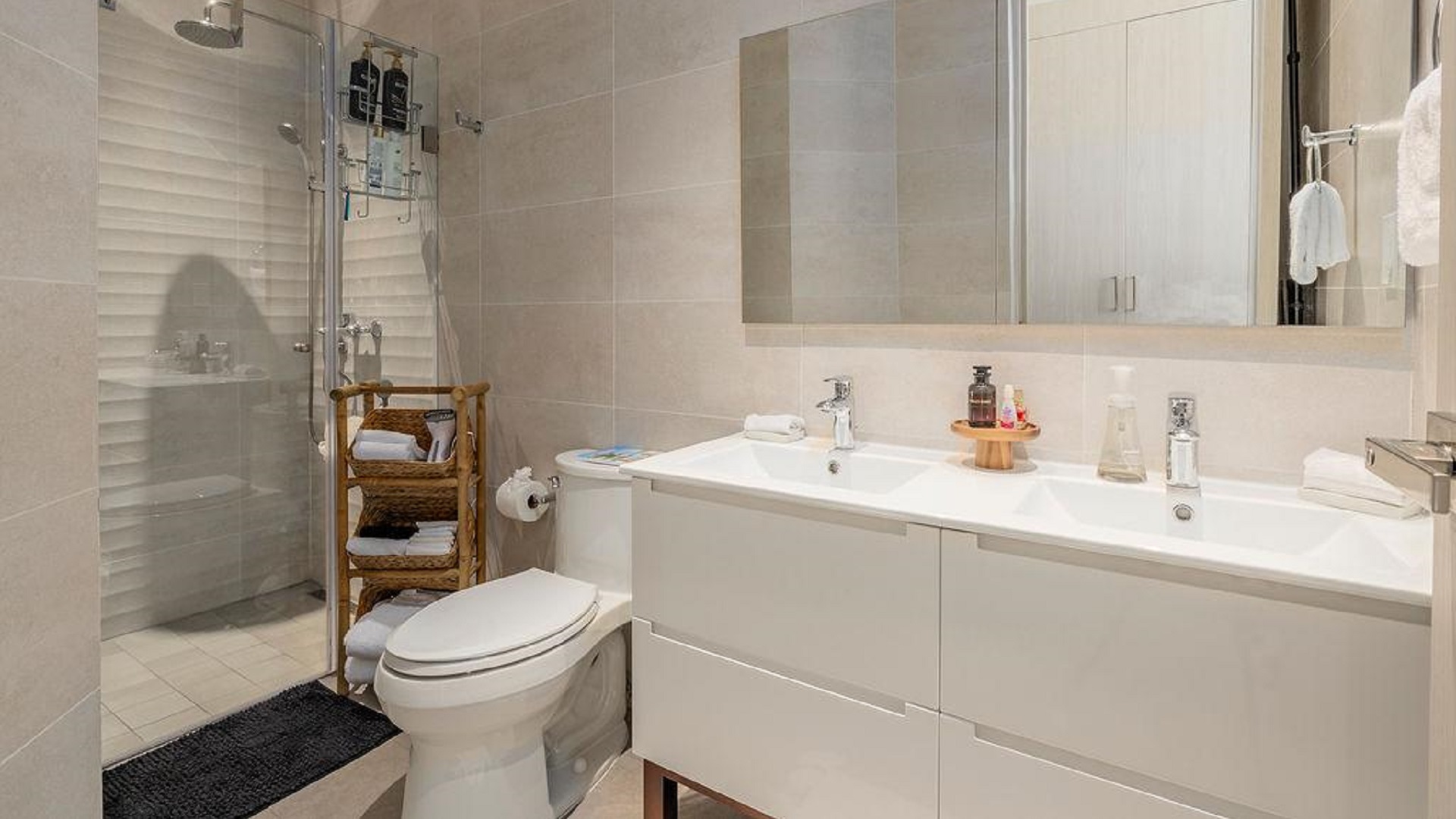 Bathroom in Penthouse PHA at The Reef Residences with double sink vanity and shower in Eagle Beach Aruba