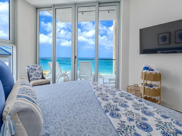Bedroom in Penthouse PHA at The Reef Residences with ocean view from bed in Eagle Beach Aruba