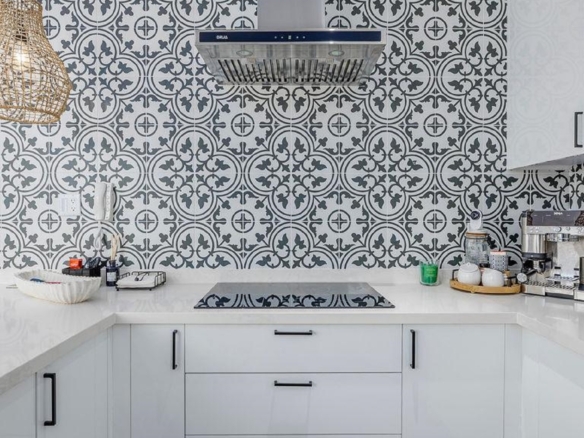 Kitchen detail in Reef Residences PHA penthouse showing patterned backsplash and countertop in Eagle Beach Aruba
