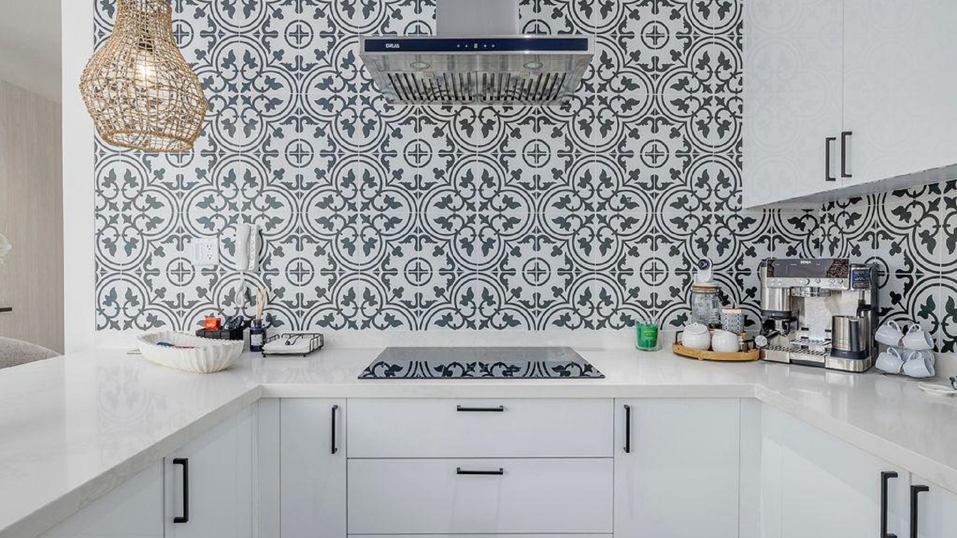 Kitchen detail in Reef Residences PHA penthouse showing patterned backsplash and countertop in Eagle Beach Aruba