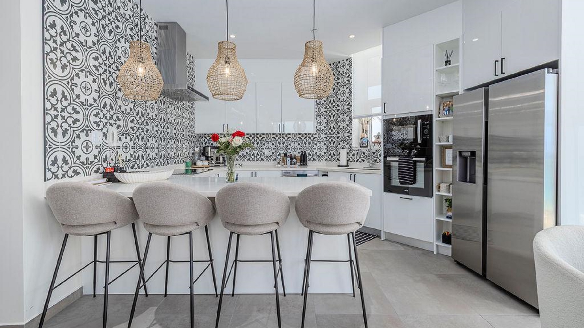 Kitchen island with seating in Reef Residences PHA penthouse featuring modern design in Eagle Beach Aruba