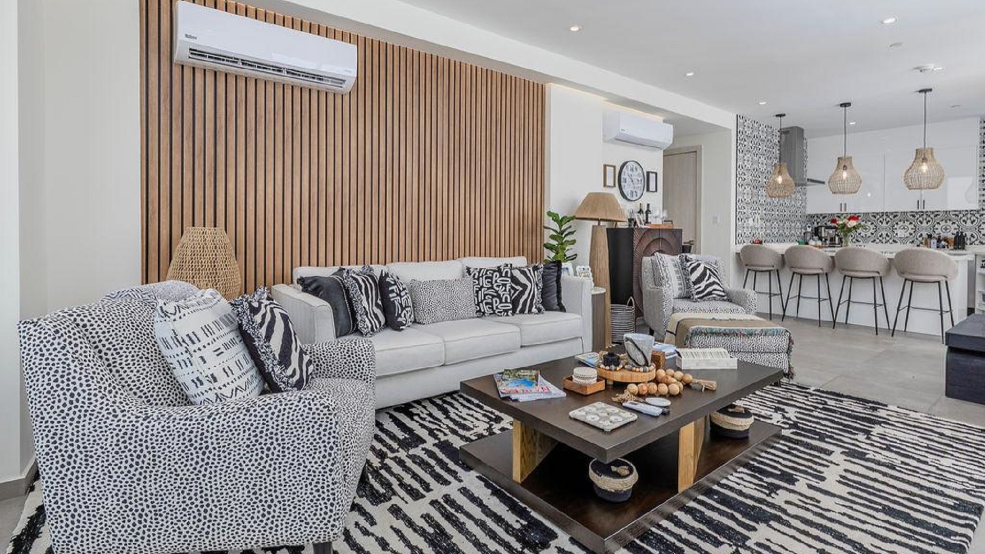 Open concept living room and kitchen in Reef Residences PHA penthouse with modern finishes in Eagle Beach Aruba