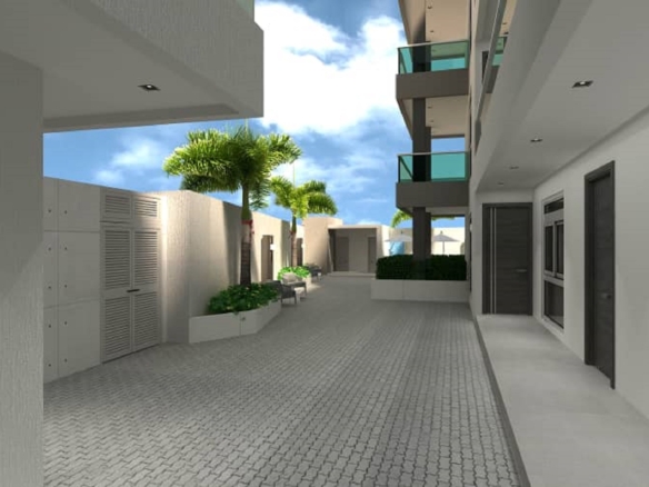 Exterior courtyard and building corridor view at Aracari Phase II condominium project in Aruba