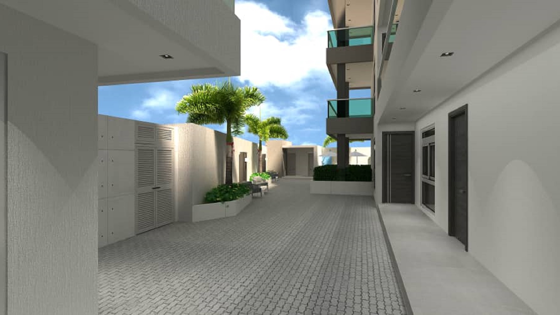 Exterior courtyard and building corridor view at Aracari Phase II condominium project in Aruba