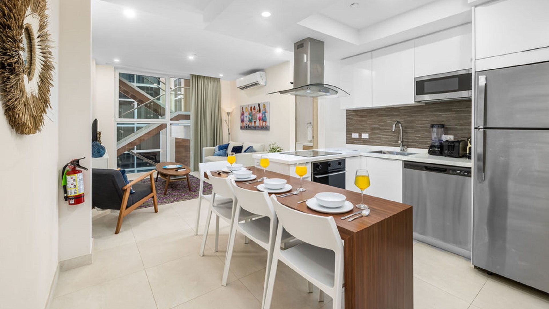 Kitchen and dining area inside Aracari Phase II Unit 13 condo in Aruba with modern appliances and dining table