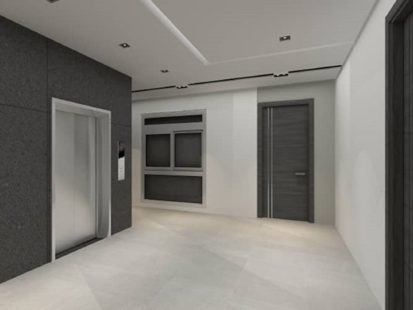 Interior hallway with elevator access inside Aracari Phase II Unit 4 condominium building in Aruba