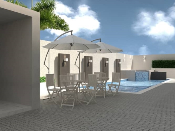 Outdoor pool and seating area at Aracari Phase II condominium development in Aruba