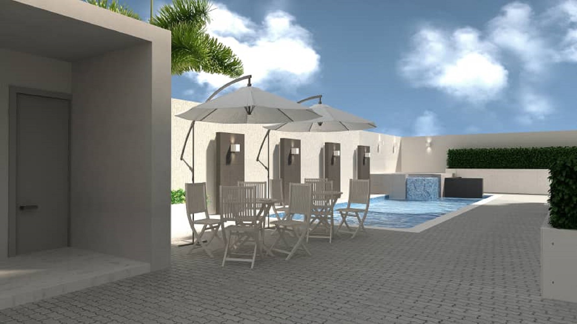 Outdoor pool and seating area at Aracari Phase II condominium development in Aruba