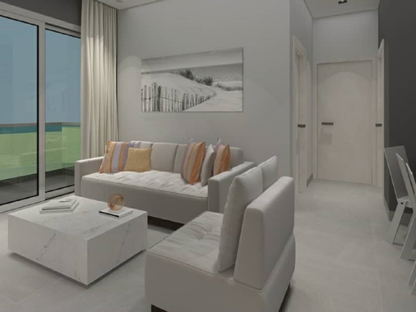 Bright living room with white sofa seating and balcony access in Aracari Phase II Unit 4 2-bedroom condominium in Aruba