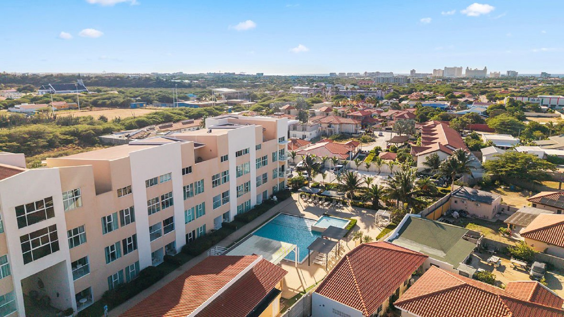 Aerial view of Aruba’s Life Garden 2 bedroom condo community with swimming pool