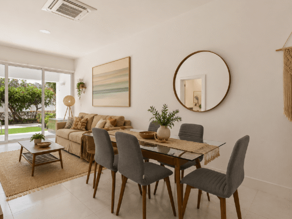 Staged dining and living area inside Aruba’s Life Garden 2 bedroom condo