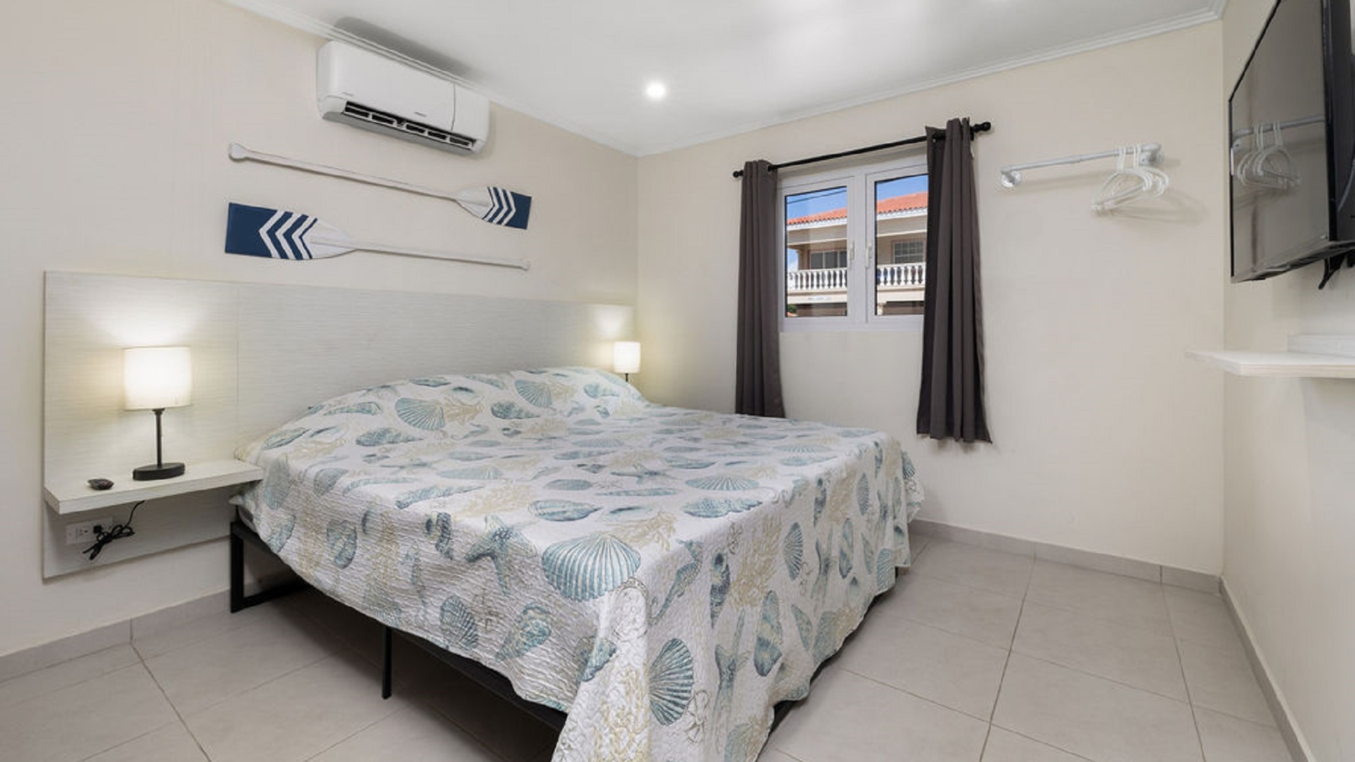 Bedroom interior at the Summerside 2-bedroom condo in Rooi Santo, Aruba with air conditioning and natural light.