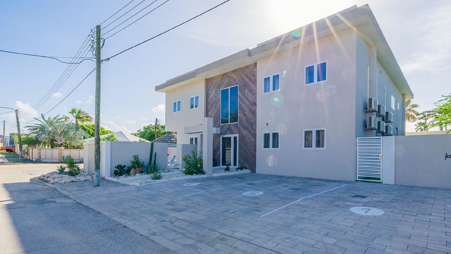 Front exterior view of the Summerside 2-bedroom condo in Rooi Santo, Aruba with modern design and private parking area.