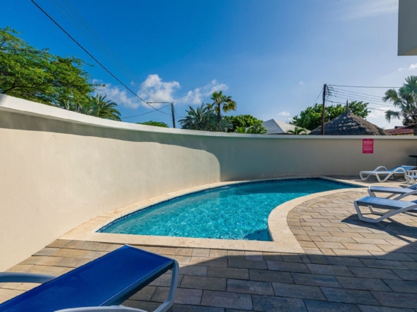 Shared swimming pool area at the Summerside 2-bedroom condo property in Rooi Santo, Aruba