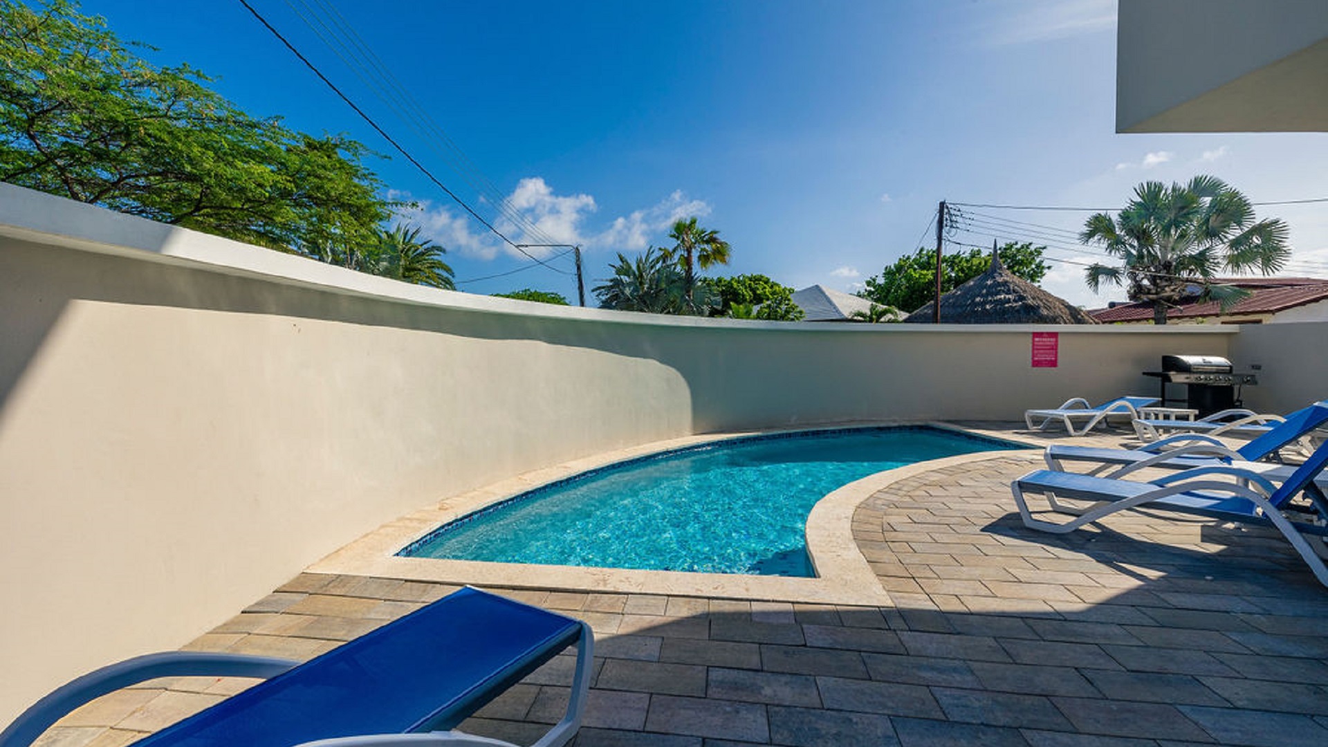 Shared swimming pool area at the Summerside 2-bedroom condo property in Rooi Santo, Aruba