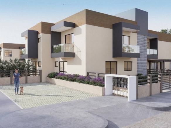 Community entrance view of Summerside III townhouse with modern architecture and vehicle access