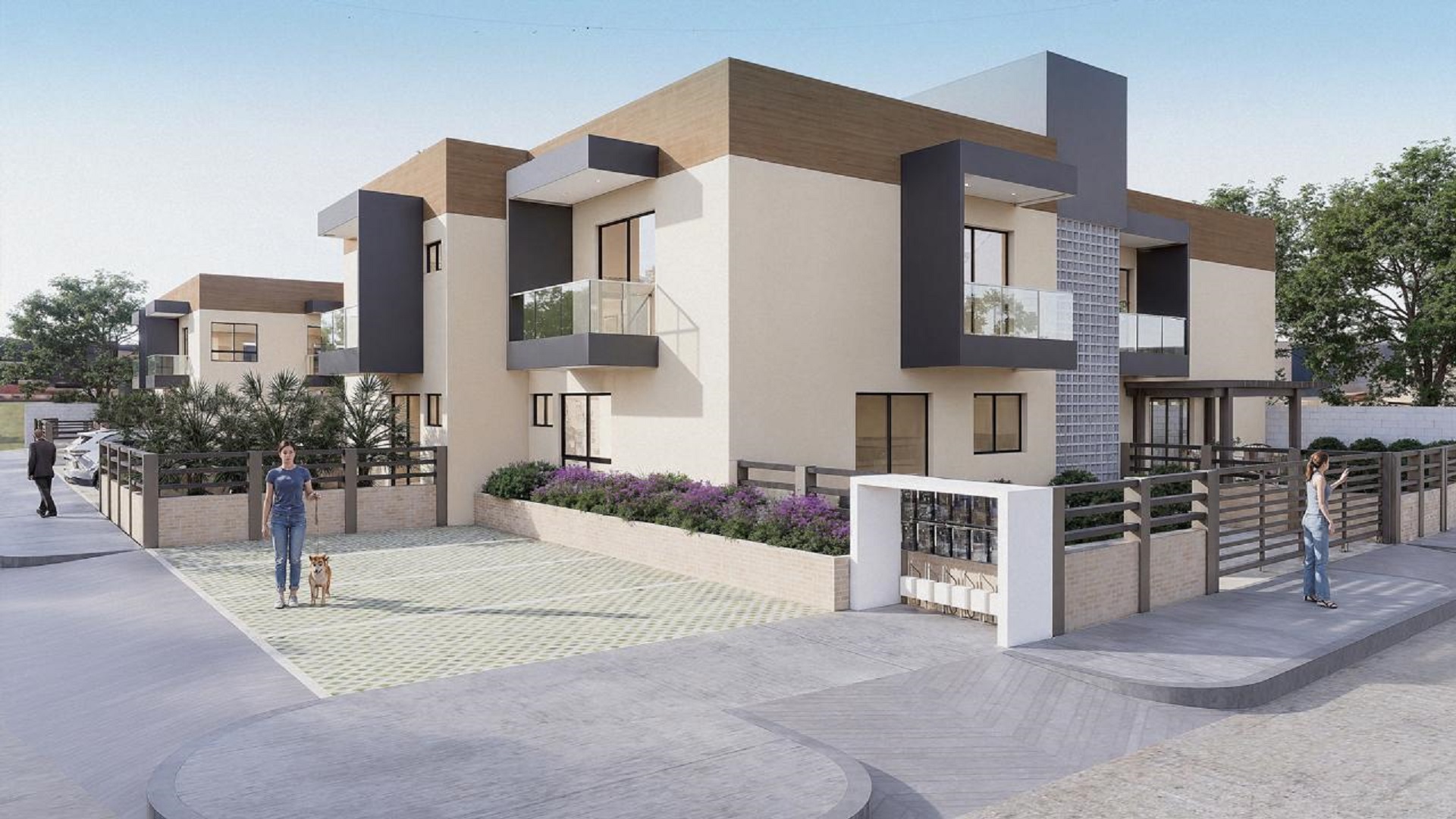Community entrance view of Summerside III townhouse with modern architecture and vehicle access