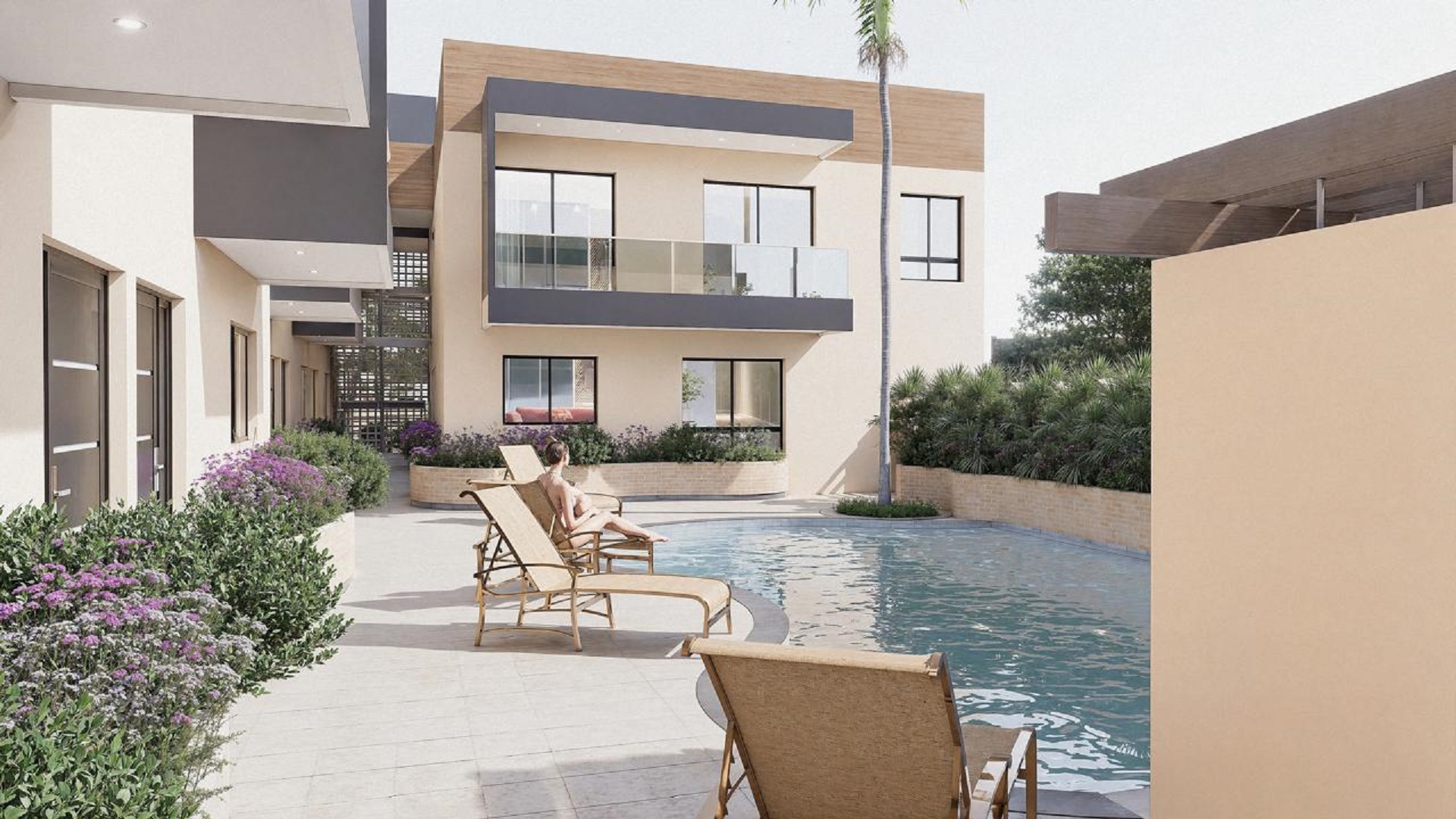 Community pool view at Summerside III townhouse featuring lounge chairs and outdoor bar area