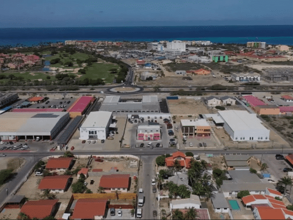 Elevated aerial view of the Commercial Office Space for Rent at Schotlandstraat 77-A Aruba and the surrounding commercial and residential area