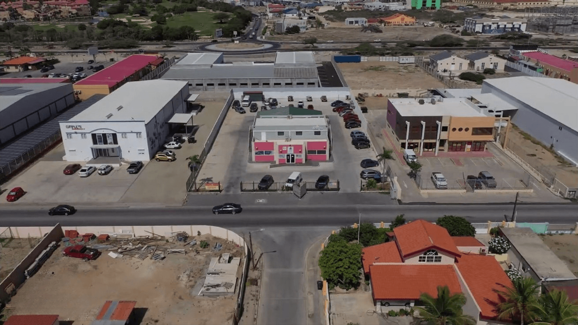 Centered aerial view of the Commercial Office Space for Rent at Schotlandstraat 77-A Aruba highlighting the building frontage and parking layout.